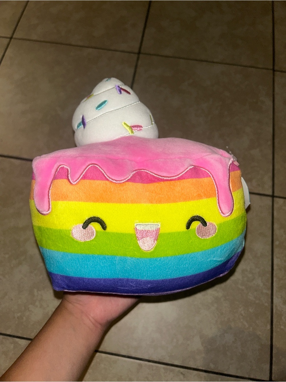 Claire’s Squishmallow Dessa rainbow cake plush